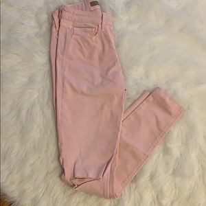 Pink ripped in the knee jeans